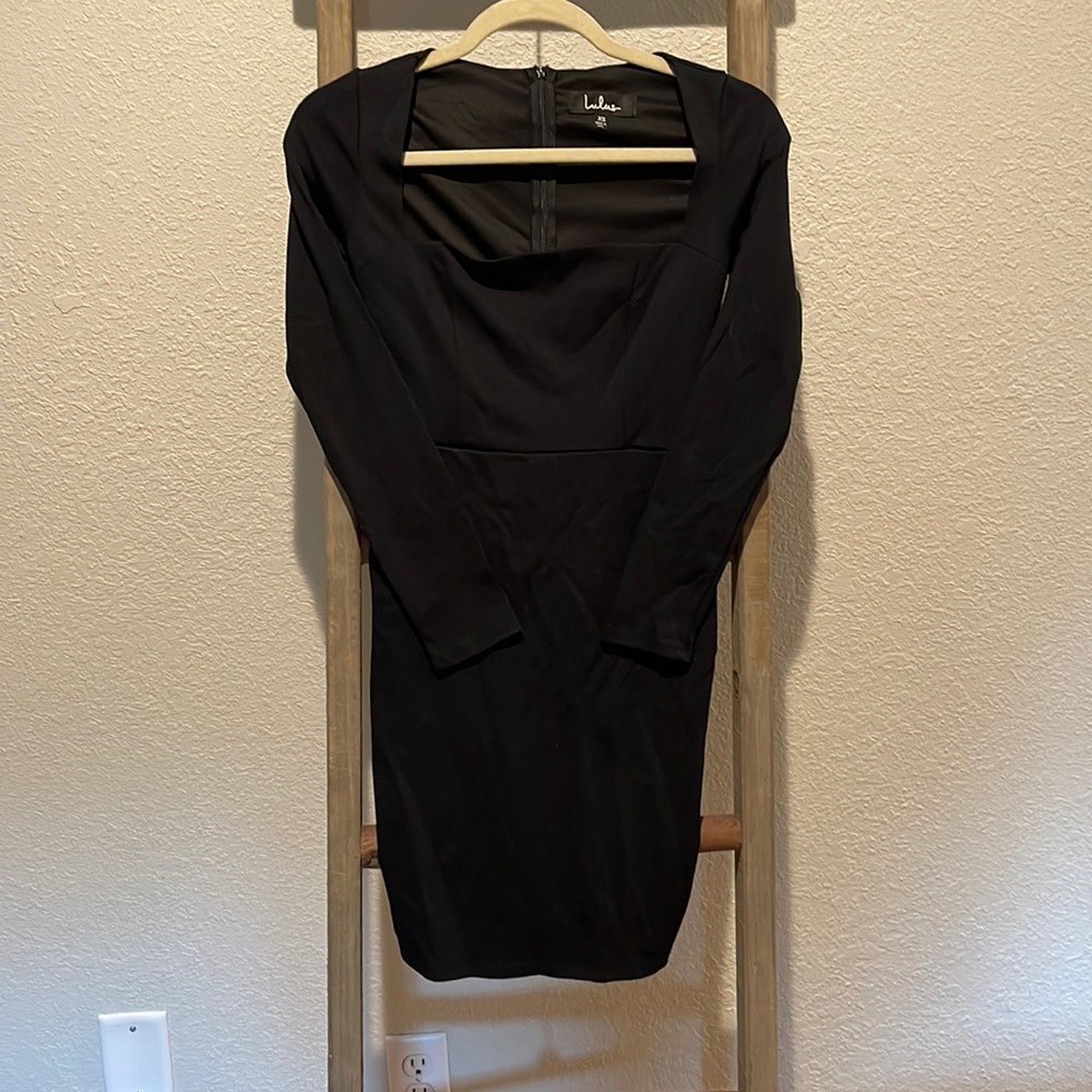 Black, long-sleeve mini dress.